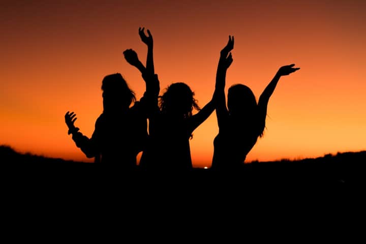 Friends dancing together at a hen party