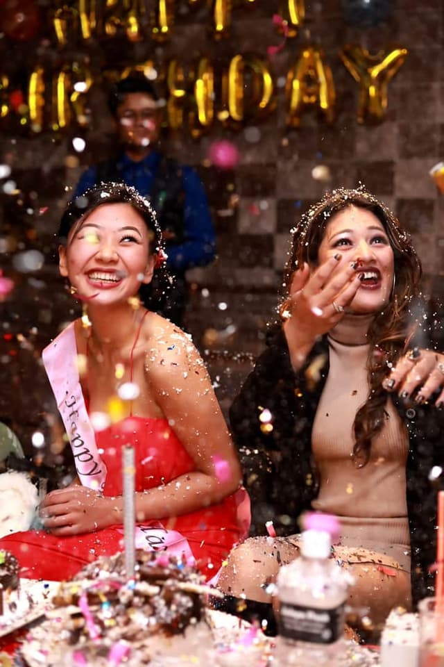 Friends celebrating with glitter